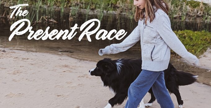 Cover of the album 'The Present Race' of a young girl and a dog walking on a beach.
